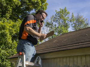 New Britain Roofer inspecting a damaged roof