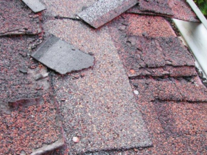 Damaged shingles on a roof - New Britain Roofer