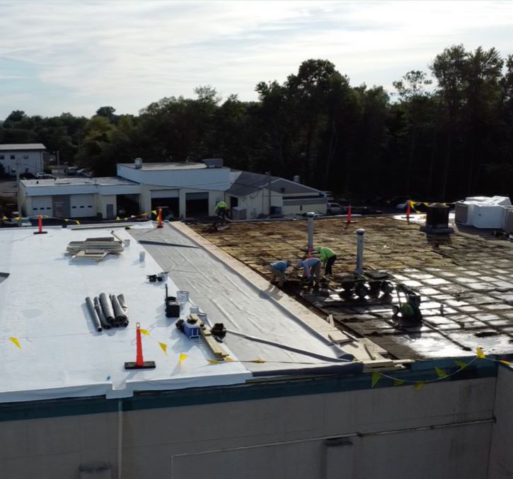 Southington commercial roofing contractors inatalling a TPO membrane roof
