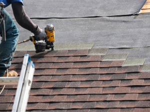 Commercial roof repair with shingles in Farmington
